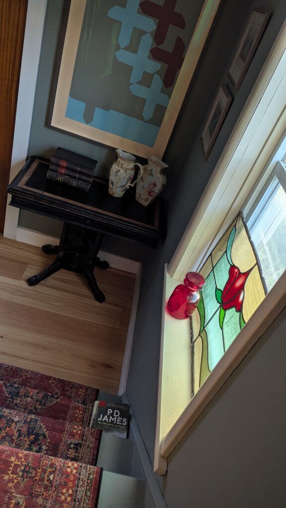 Framed Harold Town hanging by a window