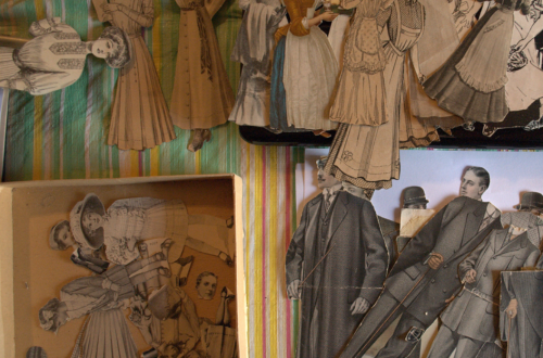Piles of vintage paper dolls