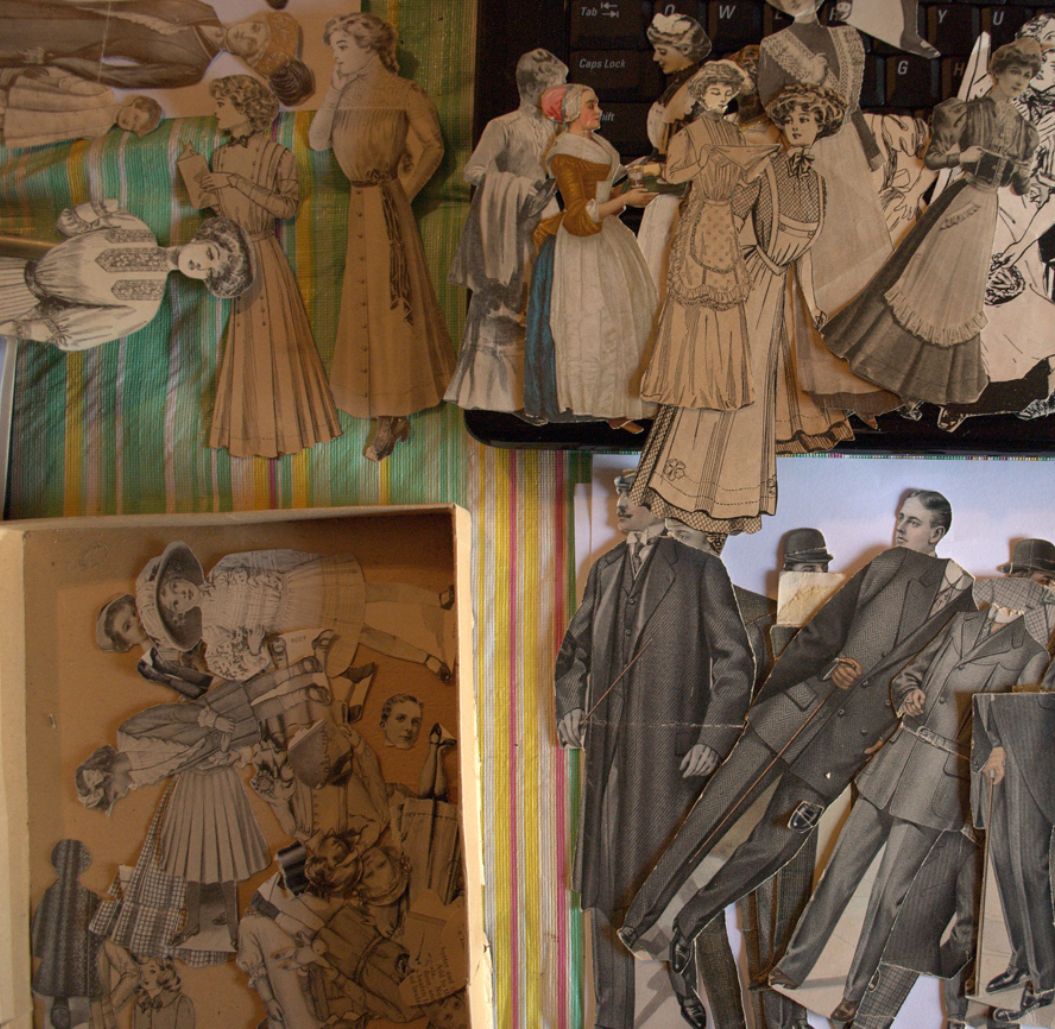 Piles of vintage paper dolls